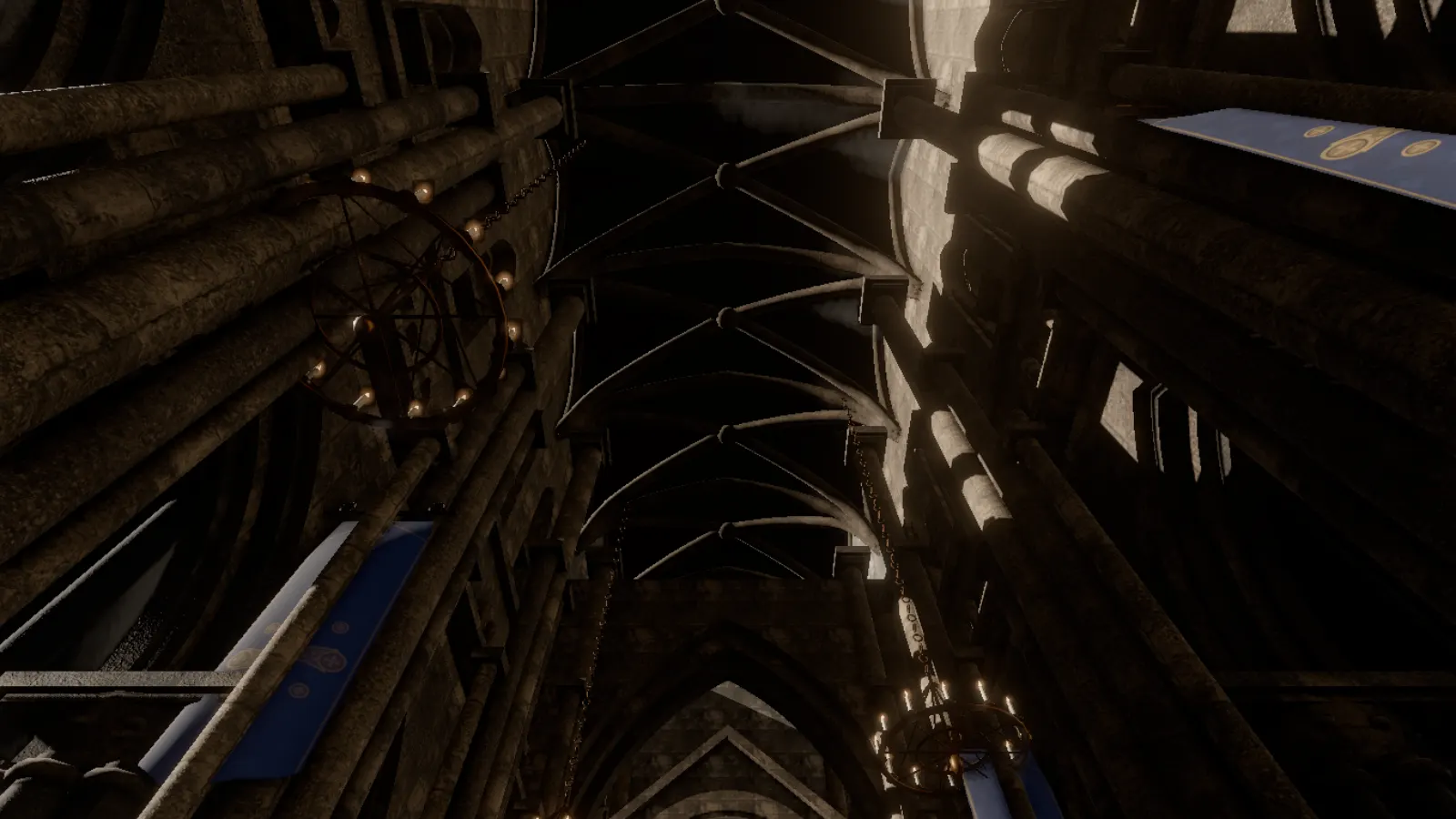 Ribbed vaults and hanging chandeliers seen from the floor.